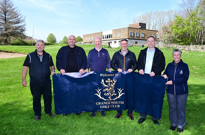 Five people lined up holding a Grangemouth Golf Club banner