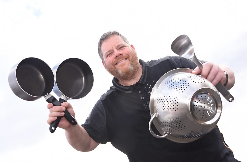 John McMorran with kitchen utensils that will be used in KLSB